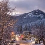 A downtown view of the city of Rossland in winter at dusk.